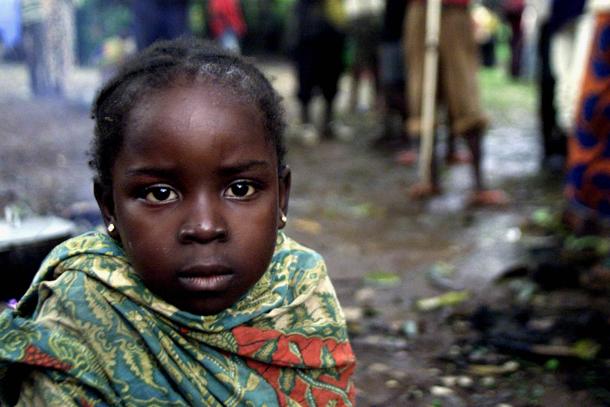 A young girl is seen among the Congolese citizens that have sought protection in the Embassy of the Democratic Republic of Congo in Bangui, Central African Republic, after being threatened and attacked by Central Africans angry at the crimes committed by the Congolese rebels. Bangui, Central African Republic on Thursday Nov. 7, 2002. Central African Republic President Ange-Felix Patasse defeated the latest uprising against his unpopular rule thanks to fighters called in from Libya and Congo - but at the cost of the pillaging of his capital, and the robbery and rape of his people, by the foreign Congo fighters, human rights groups in the cut-off city charge. (AP Photo/Christine Nesbitt)