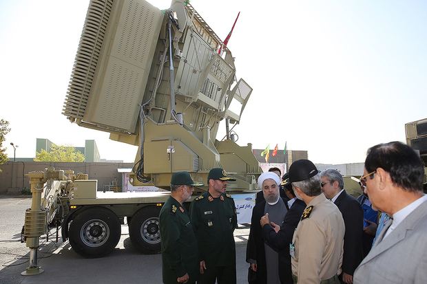 A handout picture provided by the office of Iranian President Hassan Rouhani on August 21, 2016 shows him (3rd-R) and Iranian Defence Minister Hossein Dehghan (2nd-L) standing next to the new Bavar 373 missile defence system in Tehran.
The system was designed to intercept cruise missiles, drones, combat aircraft and ballistic missiles, according to earlier statements by Dehghan.
It was intended to match the Russian S-300 system, the delivery of which was suspended in 2010 due to sanctions imposed over Iran's nuclear programme. / AFP PHOTO / IRANIAN PRESIDENCY / HO / == RESTRICTED TO EDITORIAL USE - MANDATORY CREDIT "AFP PHOTO / HO / IRANIAN PRESIDENCY" - NO MARKETING NO ADVERTISING CAMPAIGNS - DISTRIBUTED AS A SERVICE TO CLIENTS ==