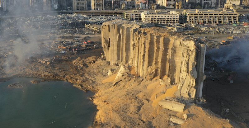 In this drone picture, the destroyed silo sits in rubble and debris after an explosion at the seaport of Beirut, Lebanon, Lebanon, Wednesday, Aug. 5, 2020. The massive explosion rocked Beirut on Tuesday, flattening much of the city's port, damaging buildings across the capital and sending a giant mushroom cloud into the sky. (AP Photo/Hussein Malla)